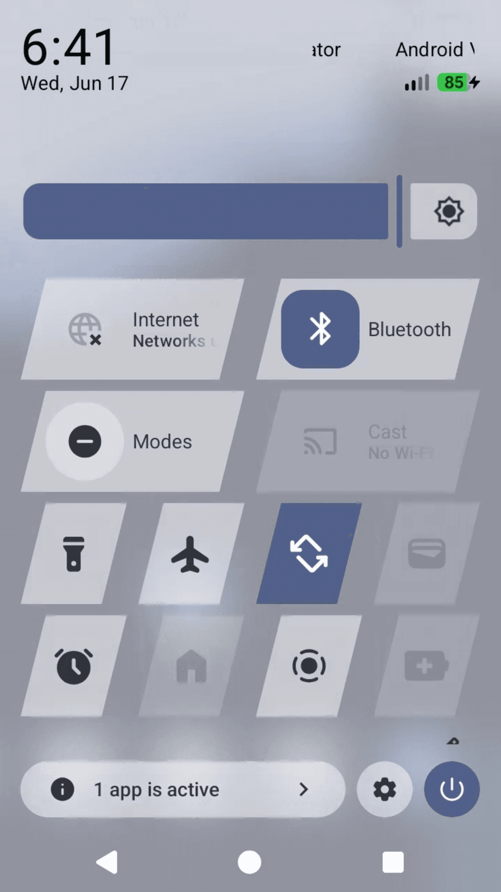 Quick Settings with the tiles rendered as slanted parallelograms, after the change