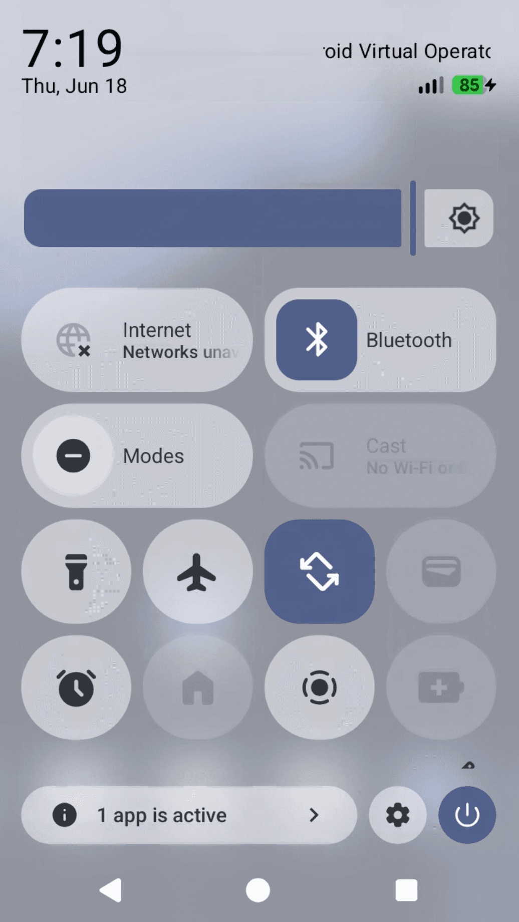 Quick Settings with the default rounded rectangular tiles, before the change